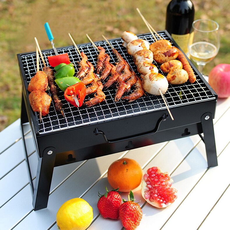Folding BBQ grill charcoal lit outdoor camping